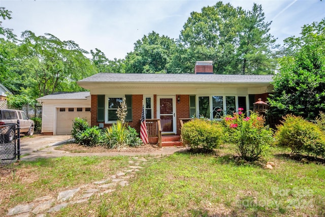 single story home with a garage and covered porch