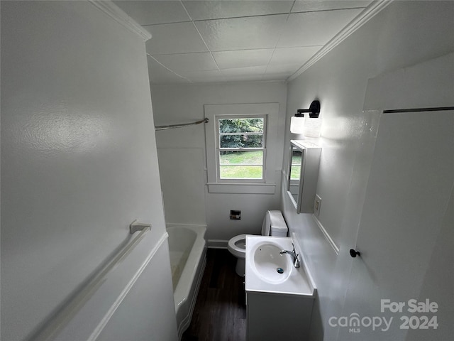 bathroom featuring toilet, hardwood / wood-style flooring, ornamental molding, and vanity