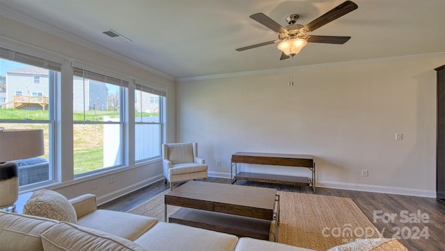 living room with ornamental molding, a wealth of natural light, ceiling fan, and dark hardwood / wood-style floors