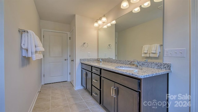 bathroom featuring tile patterned floors and double sink vanity