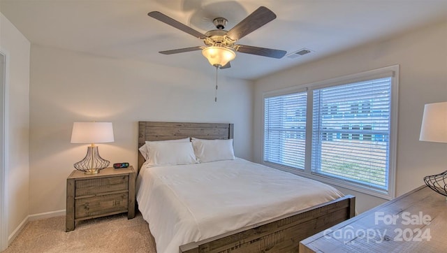 bedroom with light carpet and ceiling fan