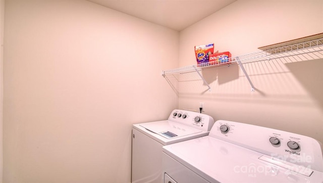 laundry area with independent washer and dryer