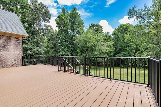 wooden deck with a yard