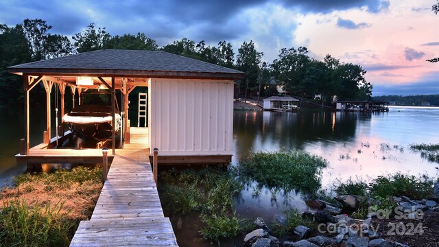 view of dock featuring a water view and boat lift