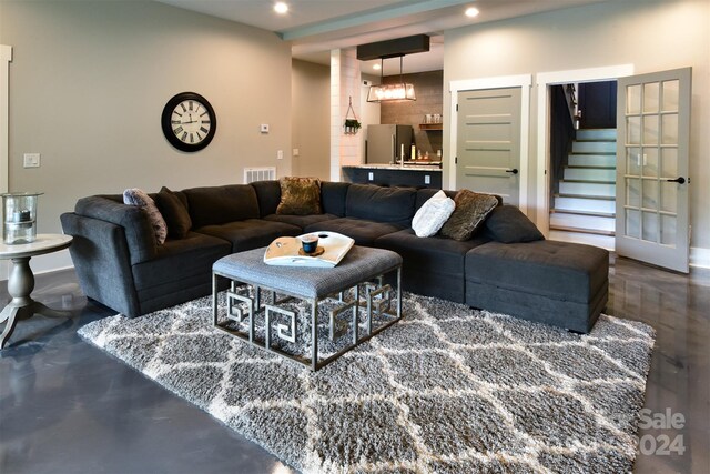 living area with stairs and recessed lighting