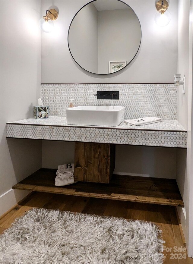 bathroom with wood finished floors and vanity