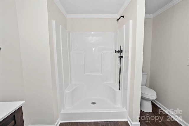 full bath with toilet, ornamental molding, walk in shower, and wood finished floors