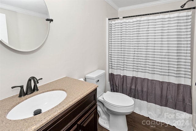 bathroom with toilet, ornamental molding, vanity, wood finished floors, and a shower with curtain