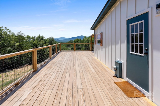 wooden deck with a mountain view