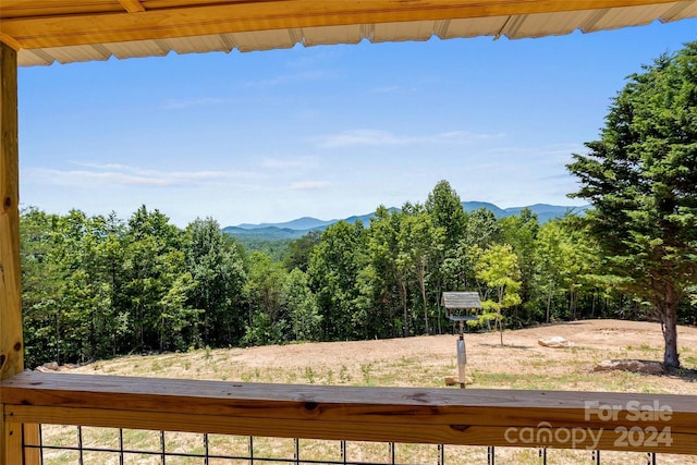 property view of mountains featuring a wooded view