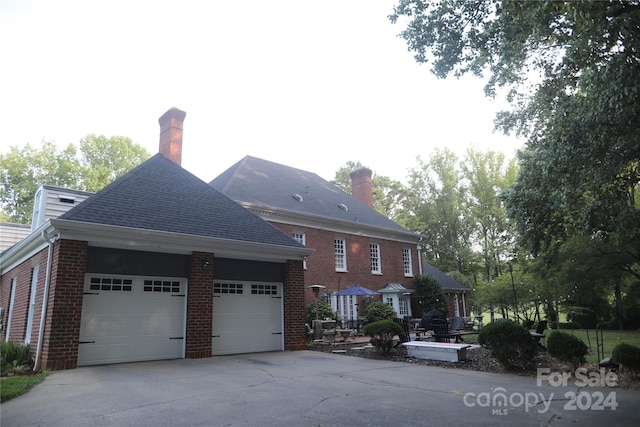 view of property exterior featuring a garage