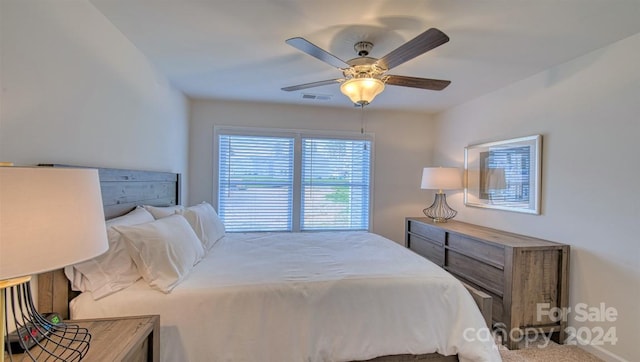 carpeted bedroom with ceiling fan