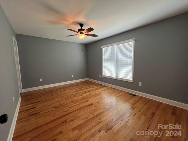 unfurnished room featuring ceiling fan and light hardwood / wood-style flooring