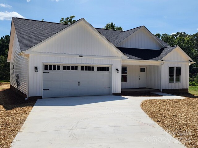 modern farmhouse style home with a garage