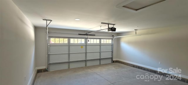 garage featuring a garage door opener