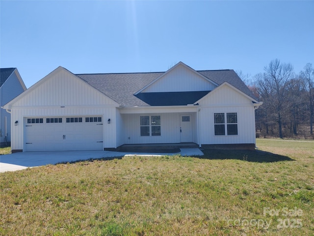 modern farmhouse with a front yard, concrete driveway, a shingled roof, and an attached garage