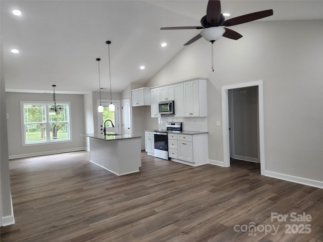 kitchen featuring baseboards, a ceiling fan, appliances with stainless steel finishes, dark wood-type flooring, and white cabinetry