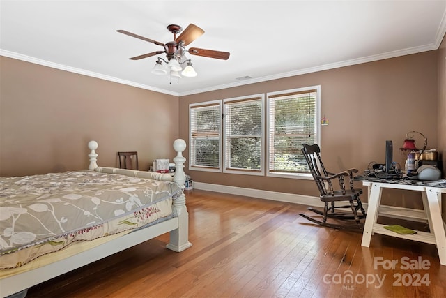 bedroom with ceiling fan, hardwood / wood-style flooring, and crown molding