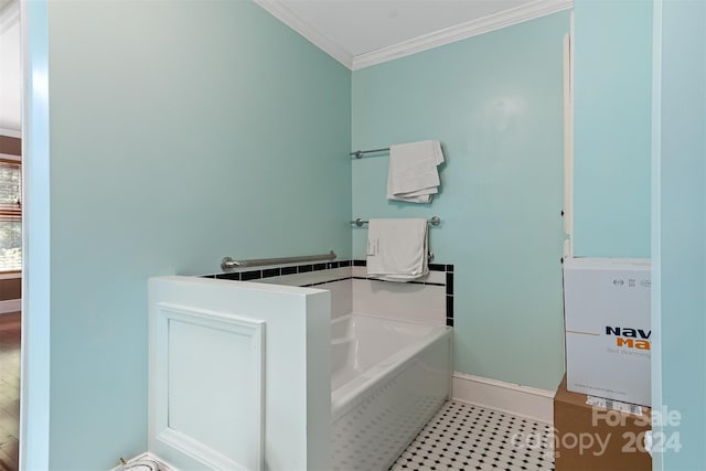 bathroom with crown molding and a tub to relax in