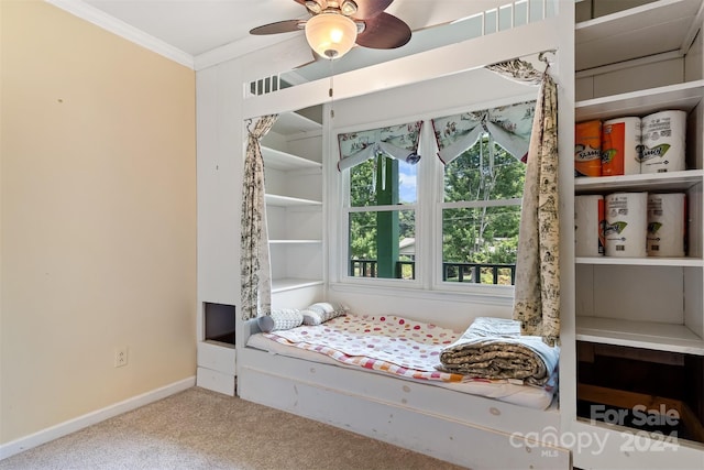 unfurnished bedroom featuring light colored carpet, ceiling fan, and ornamental molding