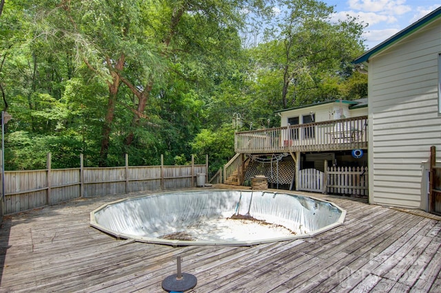 view of pool with a wooden deck