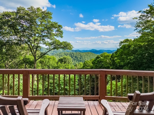 wooden terrace with a mountain view