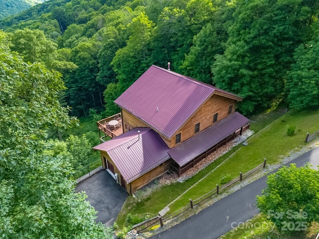 aerial view featuring a view of trees