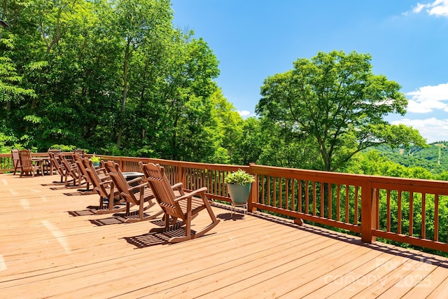 wooden deck featuring outdoor dining space