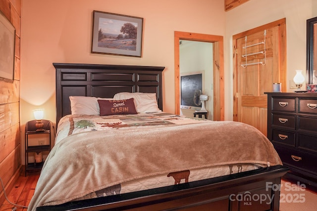bedroom featuring wood finished floors