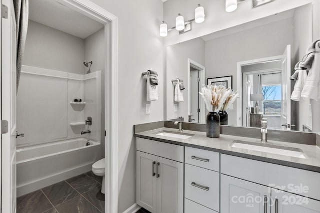 full bathroom featuring toilet, vanity, and shower / washtub combination