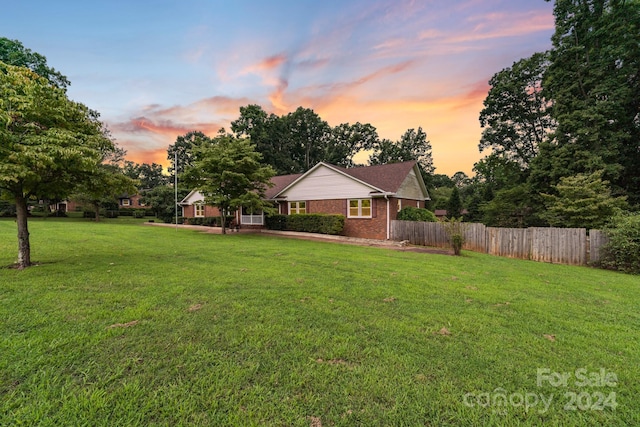 view of yard at dusk