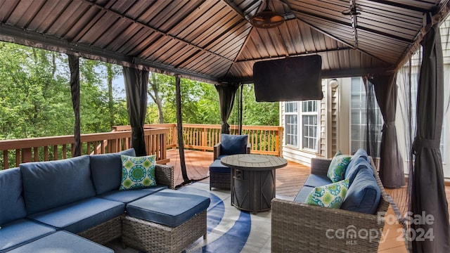 deck with a gazebo and outdoor lounge area