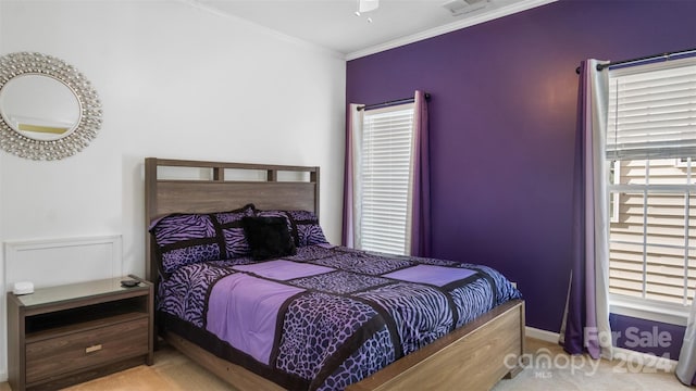 bedroom featuring crown molding, ceiling fan, and carpet flooring