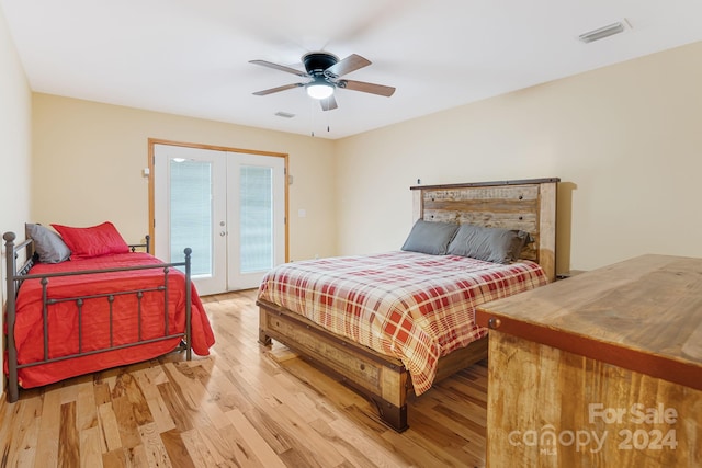 bedroom featuring ceiling fan, access to exterior, french doors, and light wood-type flooring