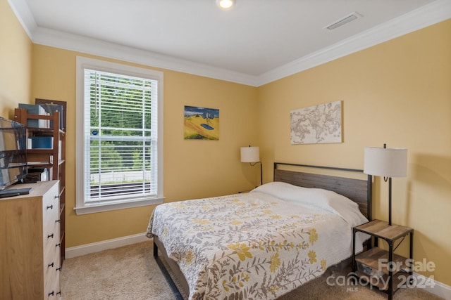 bedroom featuring crown molding and light colored carpet