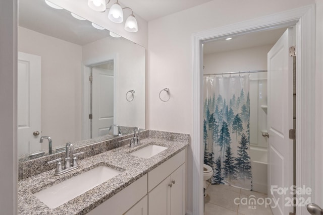 full bathroom featuring vanity, toilet, tile patterned flooring, and shower / bath combo