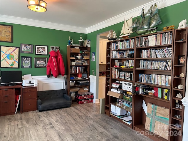 office with hardwood / wood-style floors and ornamental molding