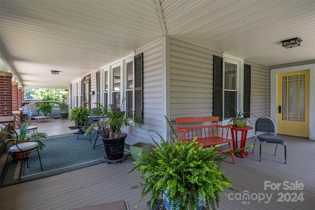 wooden deck featuring covered porch