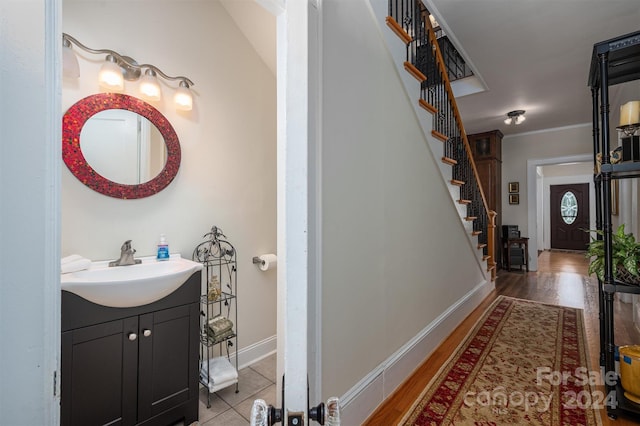 bathroom with hardwood / wood-style floors and vanity