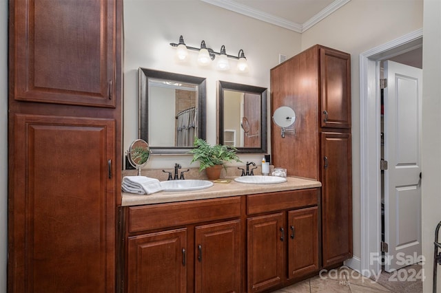 bathroom with tile patterned floors, vanity, and crown molding