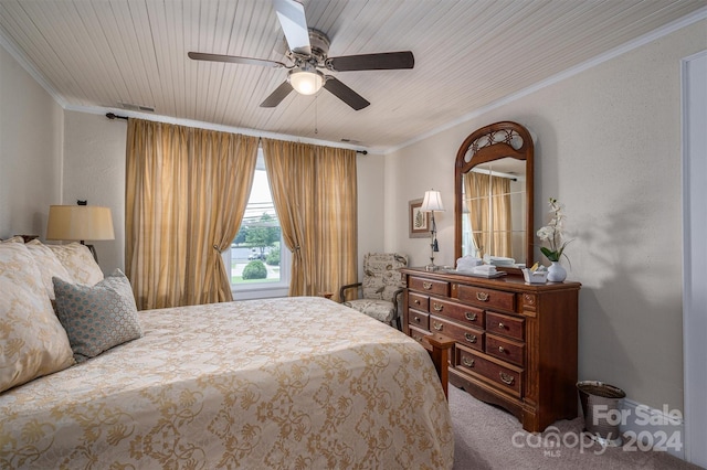 bedroom featuring ceiling fan, crown molding, wood ceiling, and carpet flooring