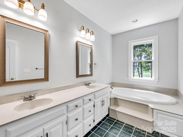 bathroom with vanity, a bath, and tile patterned flooring