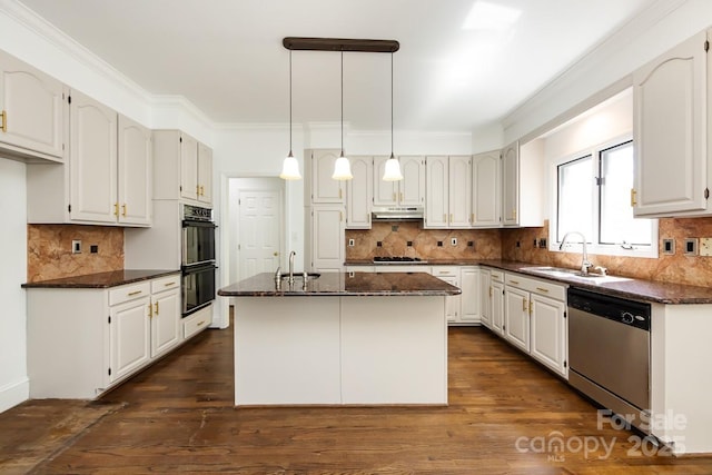 kitchen featuring white cabinetry, pendant lighting, dishwasher, and a center island