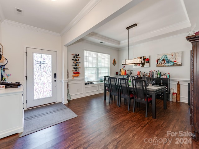 dining area featuring crown molding and dark hardwood / wood-style floors