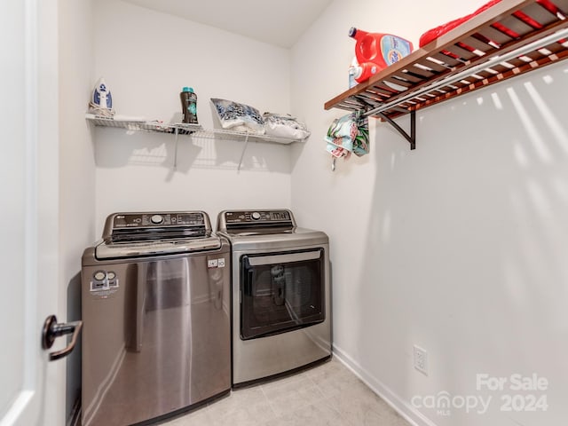 laundry room featuring washing machine and clothes dryer