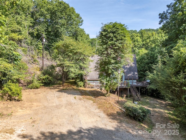 view of yard featuring a wooden deck