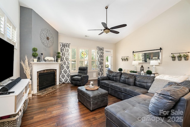 living room with ceiling fan, a fireplace, dark wood-type flooring, and lofted ceiling