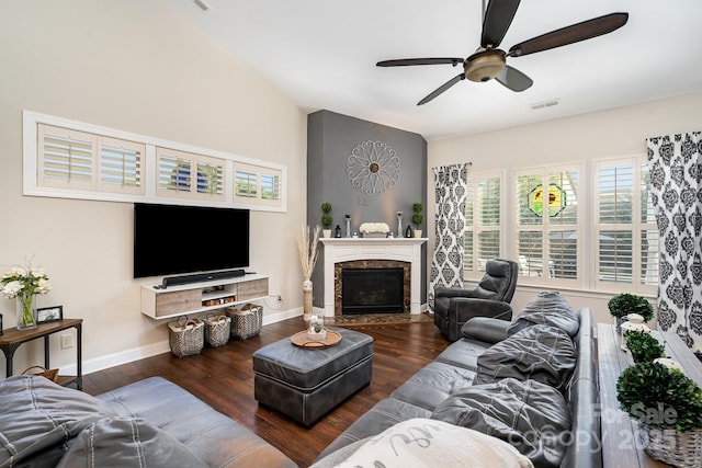 living room featuring ceiling fan and dark wood-type flooring