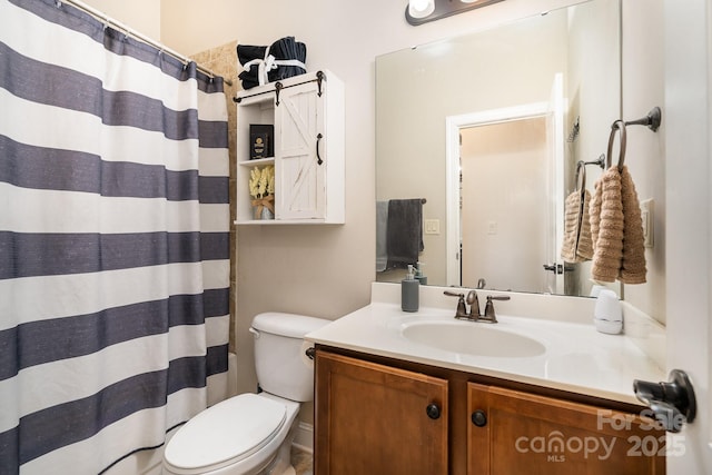 bathroom with a shower with curtain, vanity, and toilet