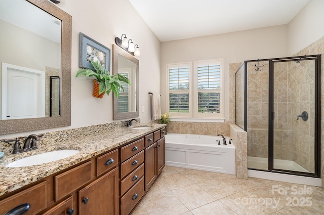 bathroom featuring tile patterned floors, vanity, and separate shower and tub